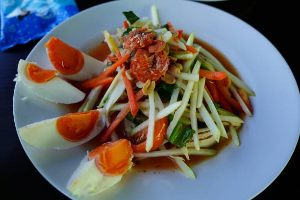 Close-up Thai papaya salad salted egg on plate