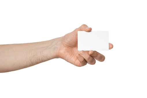 Blank business card or plastic card in a male hand, isolate.