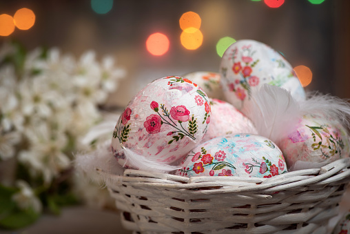Decoupage decorated Easter eggs white eggs on a festive background