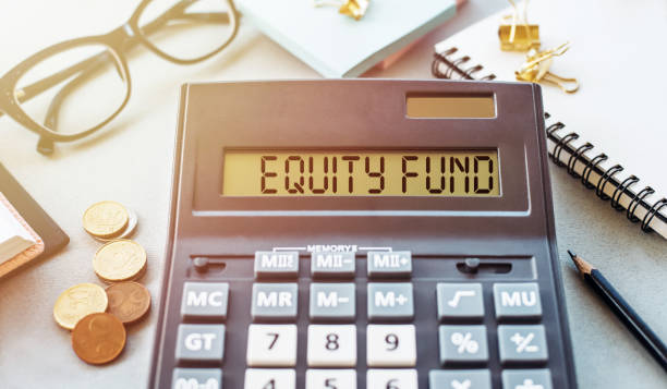 istock EQUITY FUND. Word written on calculator on office table. 1457412657