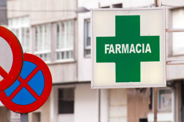 Pharmacy sign in spanish language,  green cross