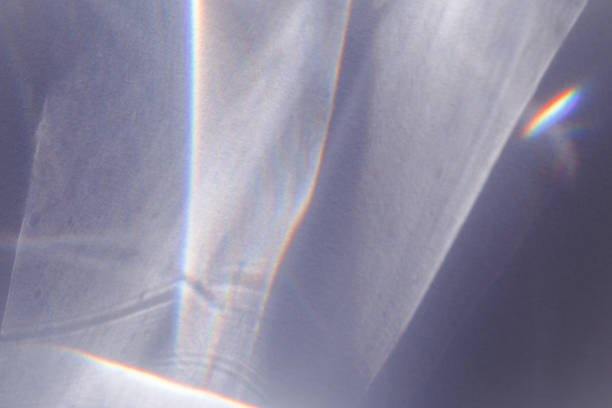 istock Sunlight background, abstract photo with light and shadow, glare and shine on paper texture, rainbow flare from sun, gray blue minimal aesthetic fon. Natural light and caustic effects. 1457417105