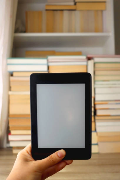 E-Reader and Print Books stock photo