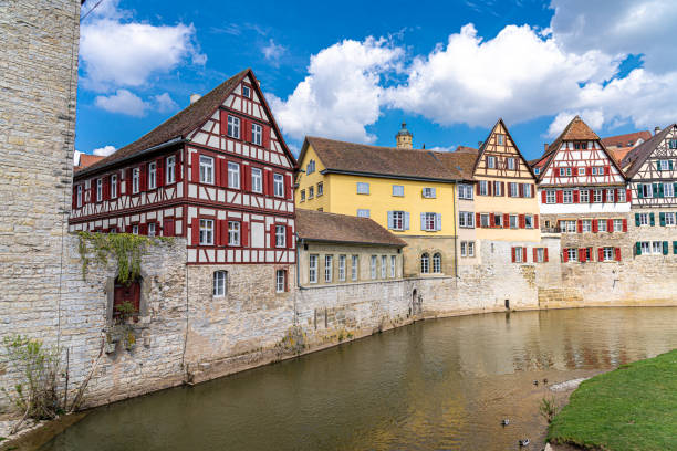 Old half-timber houses with colored shutters along the river