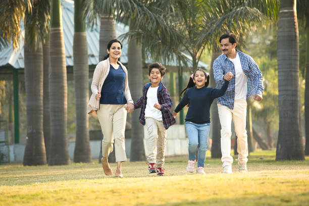 istock Happy multi-generation family running at park 1457417802