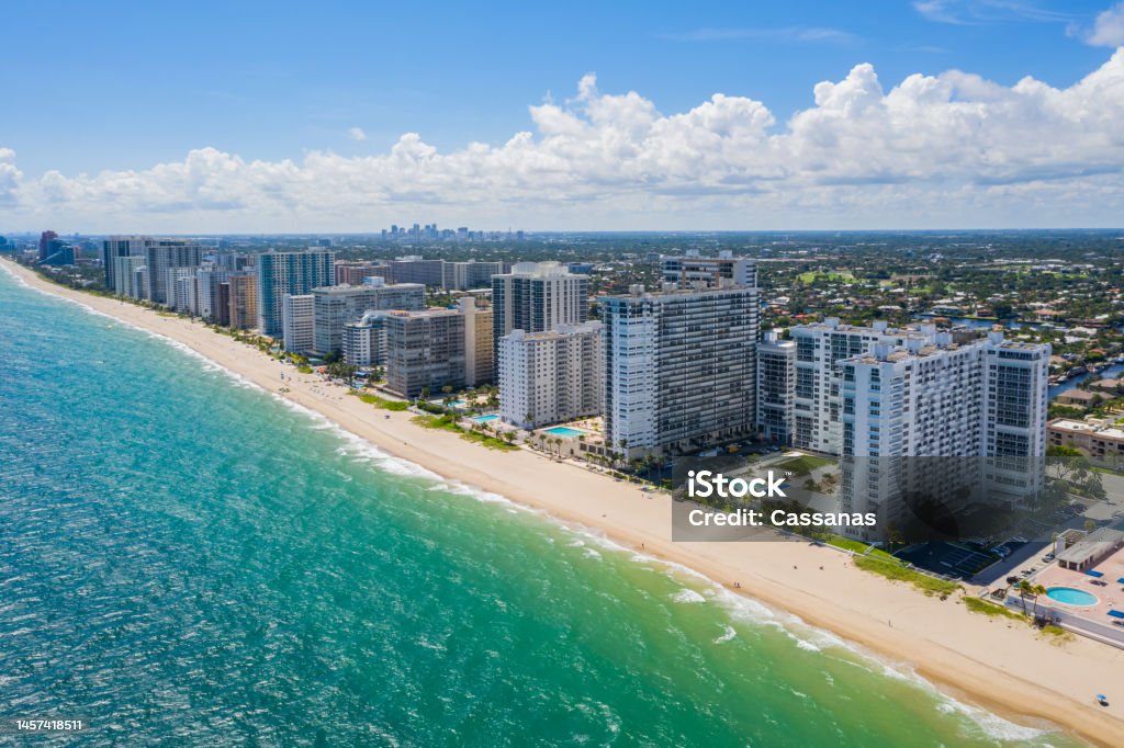 Aerial drone view Aerial drone view of the coastline of the Galt Mile neighborhood, in Fort Lauderdale, beach with modern buildings, towers, palms, turquoise sea, blue sky Fort Lauderdale Stock Photo