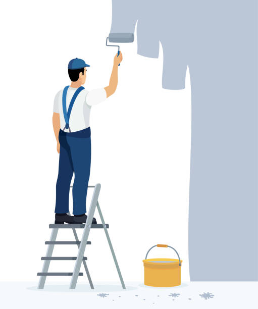 ilustraciones, imágenes clip art, dibujos animados e iconos de stock de pintor profesional en el trabajo. pintor hombre en uniforme sosteniendo un rodillo de pintura. - house painter painting paint wall