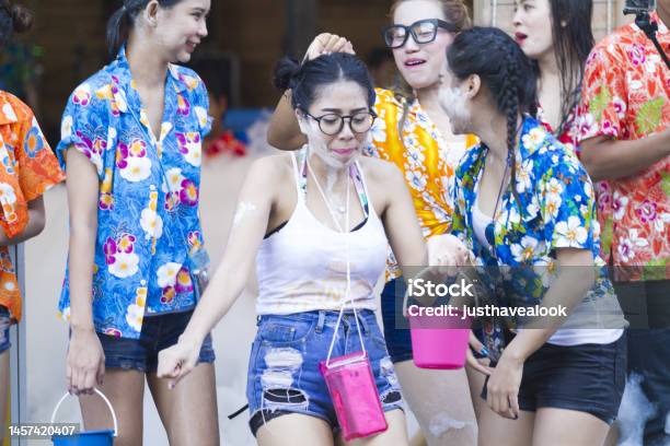 Portait Of Happy Dancing Colorful Dressed Thai Women Captured Wet At Songkran Stock Photo - Download Image Now