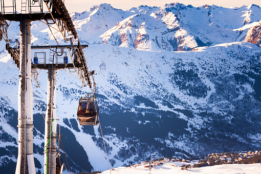 Gondola lift in ski resort in winter Alps mountains, France. Meribel, France.