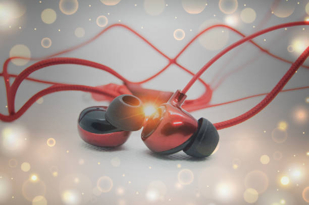 Close up of white earbuds on white background