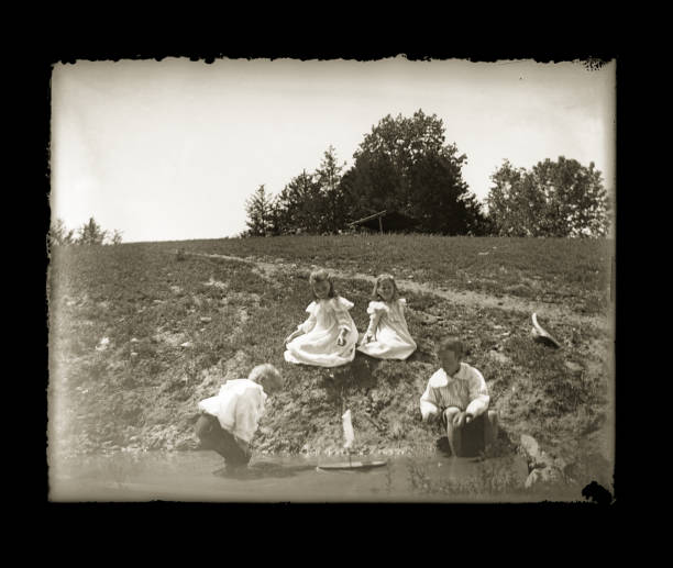 istock Victorian-era Children Playing with a Toy Boat, Circa 1890 1457421220