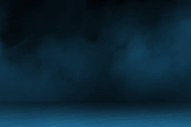 blue concrete marble stone floor with smoke float use as background for advertising. abstract dark blue background, smoke, smog. empty dark scene, neon light, spotlights. concrete floor.
