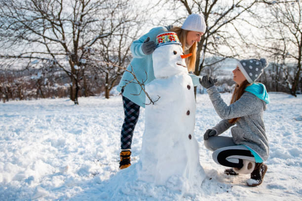 istock Making a Snowman with my girl 1457422691