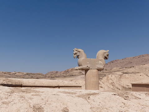Sculpture of Huma bird Griffin-like column capital statuary in an ancient city of Persepolis, Shiraz Iran