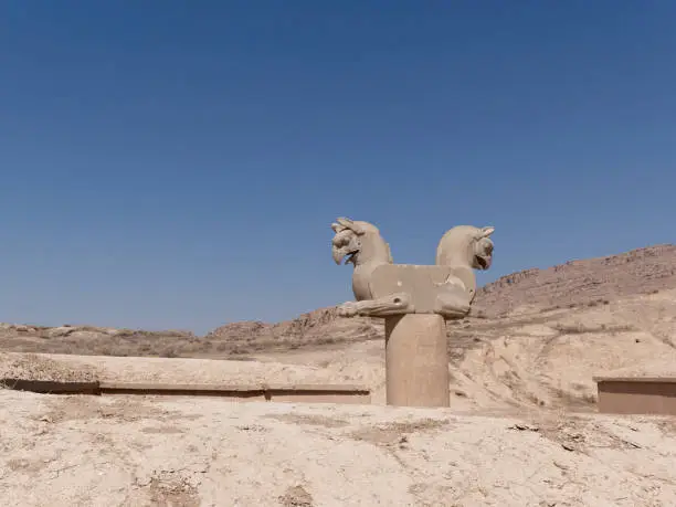 Sulpture of Huma bird Griffin-like column capital statuary in an ancient city of Persepolis, Shiraz Iran