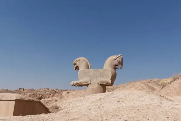 Sulpture of Huma bird Griffin-like column capital statuary in an ancient city of Persepolis, Shiraz Iran