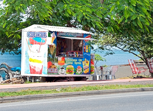 Generic Churchill ice-cream stall, Puerto Caldera, Gulf of Nicoya, Province of Puntarenas, Costa Rica. Churchill ice-cream is a generic term for the mixture of fruit, syrup and ice-cream peculiar to the Puntarenas area. Costa Rica shows little evidence of its colonial history but abounds in shimmering vibrant colours and diversity of plant and animal species within its varied landscapes of coastal territory and tropical rainforest that hosts migration from north America and south America to give it unparalleled variety.