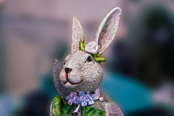 istock Easter rabbit figurine  head and shoulders 2 - dressed in shiny clothes - abstract blurred background and room for copy 1457429167