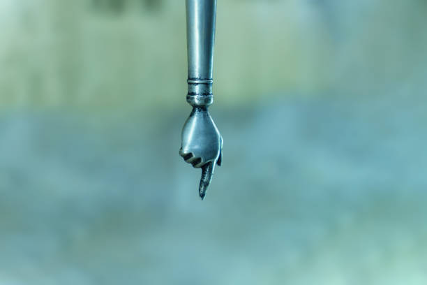 Detail of the Fountain of the Four Rivers in Rome,  by Bernini, sited in Piazza Navona. Isolated Hand of one of the statues representing Rio de la Plata river, on a white background.