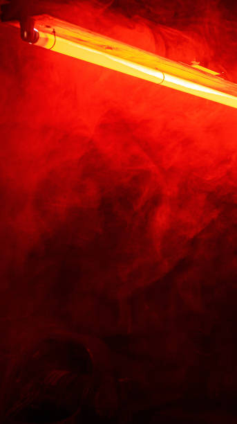 red, hellish corridor full of smoke lit with a red fluorescent and industrial of a bunker. - brightly lit audio imagens e fotografias de stock