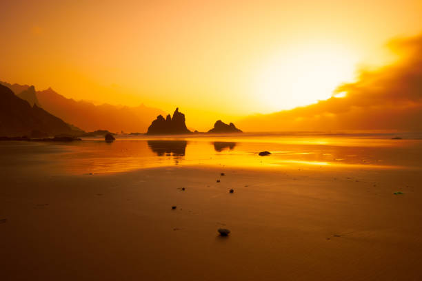 Sunset at Benijo beach with mountains in the background