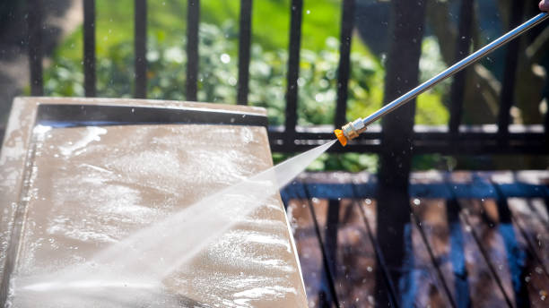 istock Cleaning plastic box on deck with pressure washer detail 1457435092