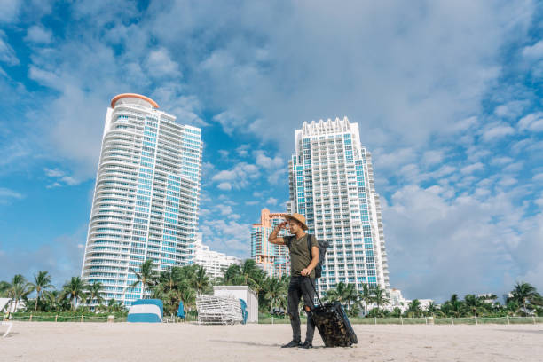 Handsome Man has just arrived at the beach stock photo