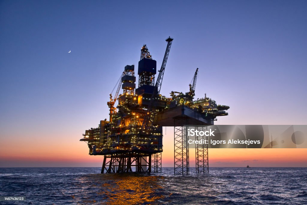 Offshore oil and gas platform on production site. 
Jack up rig crude oil production in the North Sea. Offshore Platform Stock Photo