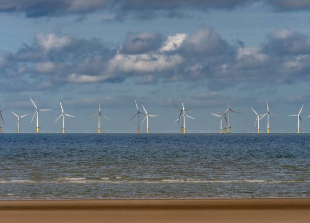 istock Wind Farm and Sand Patterns on a Welsh Beach, Rhyl, Wales, UK 1457450981