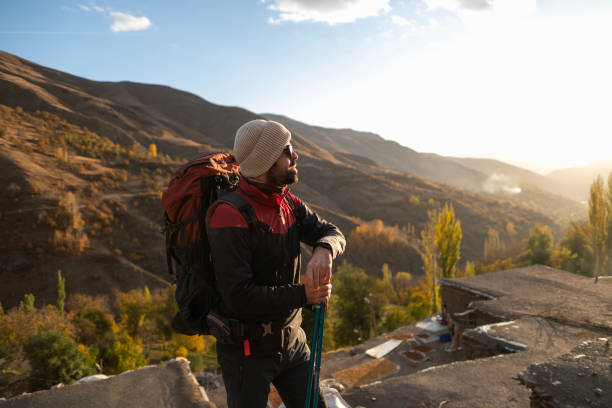 istock Young man traveling and walking on the forest walkway trail 1457453908