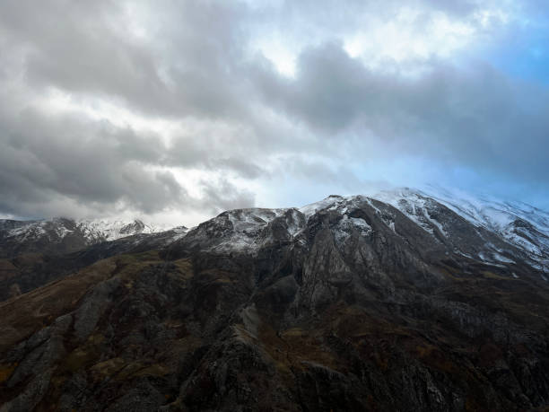 istock Aerial view of hiker on mountain summit 1457454989