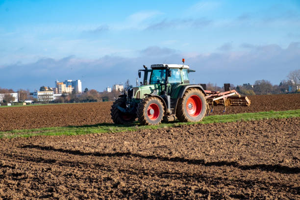 istock tractor plowing the fielld 1457455944