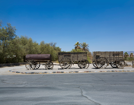 old waggon at the entrance of the Furnance Creek Ranch in the middle of Death Valley, with these wagons the first men crossed the death valley in the 19th century