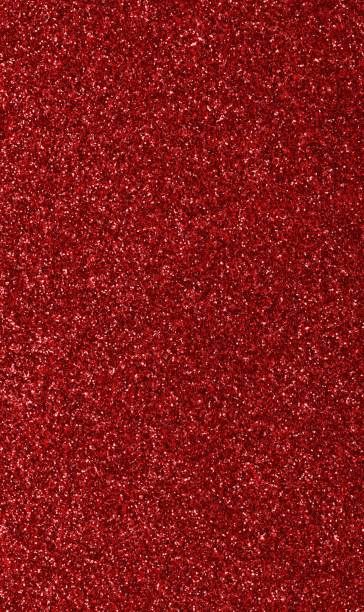 istock red background with shiny glitter with luminescent lights 1457456841