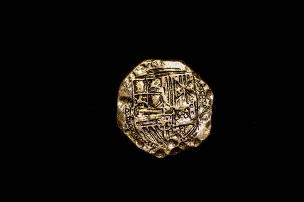 istock Golden Spanish Coins with black background 1457457858