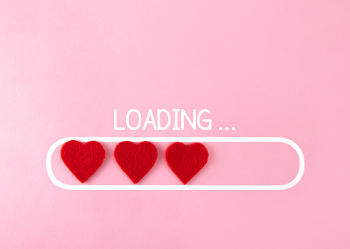 Loading symbols with hearts on a pink background