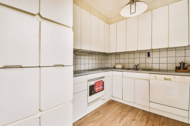 istock Interior of modern kitchen with white furniture 1457460131