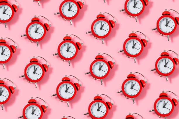istock Alarm Clock on Pink Background 1457460791