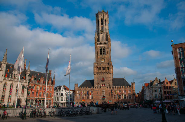 The Town Square with a clock tower in the summer on a sunny day in Bruges, Belgium