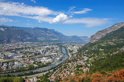 The scenic view of River Isere and European alps in Grenoble, France.