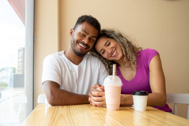 istock couple having coffee and milkshake 1457469954