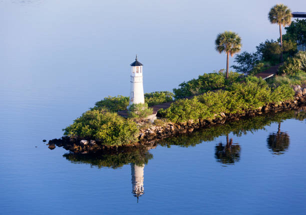 The morning view of Tampa city lighthouse with reflection in Hillsborough Bay (Florida).