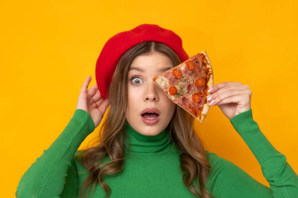istock Pretty woman presents most delicious pizza. 1457482879