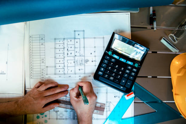 istock Architect Working on a new house blueprint 1457486788