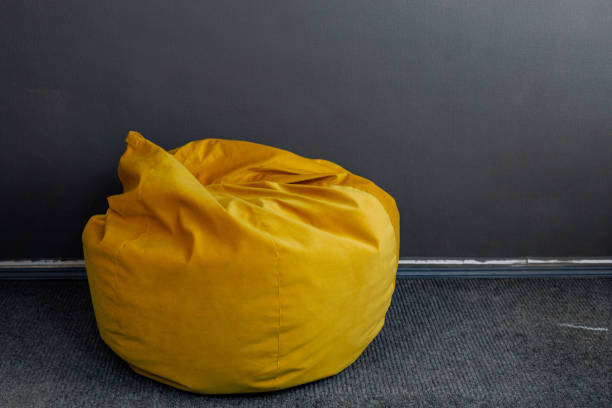 istock Ottoman or bag chair in the room. Background with copy space for text 1457488593