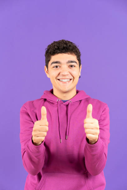 istock Hispanic teenager boy making ok sign at camera 1457488639