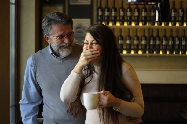 istock Happy mature couple laughing 1457492337