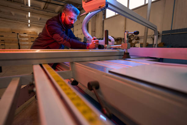 istock Portrait of man fixing machine at work 1457495903