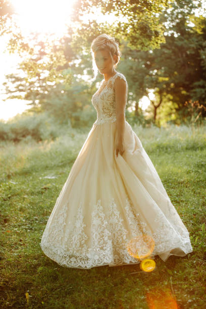 istock Beautiful young bride enjoying sunny day in nature 1457497202