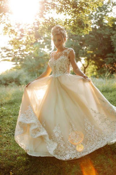 istock Beautiful young bride enjoying sunny day in nature 1457497203